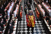 Soldiers of The Queen’s Company of the Grenadier Guards carry the coffin of Queen Elizabeth II