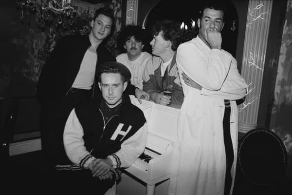 Frankie Goes To Hollywood in 1986. Singer Holly Johnson is seated by the piano, and behind him are (left to right) bassist Mark O’Toole, drummer Peter Gill, guitarist Brian Nash and singer Paul Rutherford. 