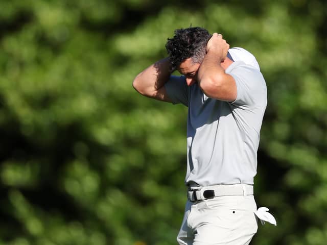 Rory McIlroy reacts after a double bogey on the 11th hole on day two of the Masters