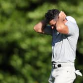 Rory McIlroy reacts after a double bogey on the 11th hole on day two of the Masters