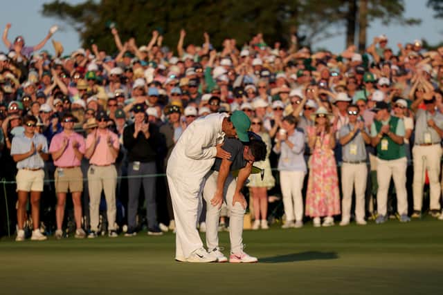 Relief for Rory McIlroy and Harry Diamond on the 18th hole at Augusta National