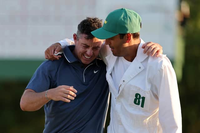 Caddie Harry Diamond, right, congratulates Rory McIlroy after his dramatic play-off victory over Justin Rose at the Masters