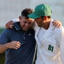 Caddie Harry Diamond, right, congratulates Rory McIlroy after his dramatic play-off victory over Justin Rose at the Masters