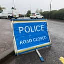 The road remains closed as police respond to a collision