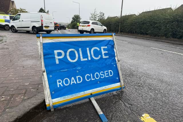 The road remains closed as police respond to a collision