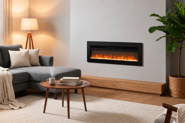 Black wall-mounted electric fireplace with colourful flame display and remote control