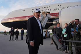 U.S. President Donald Trump speaks with journalists prior to boarding Air Force One at Shannon Airport