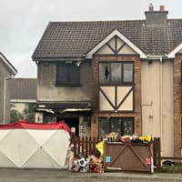 Man and woman charged over fatal arson attack remanded into custody