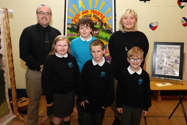 Cranmore IPS pupils, teacher Andrew Duggan and the artist who helped create the felt picture with their Carson Award-winning picture.
