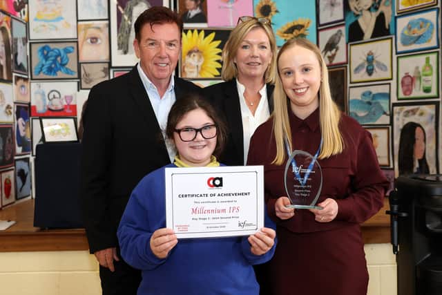 Tony and Edna Carson presenting a Carson Award to a teacher and pupil from Millennium IPS