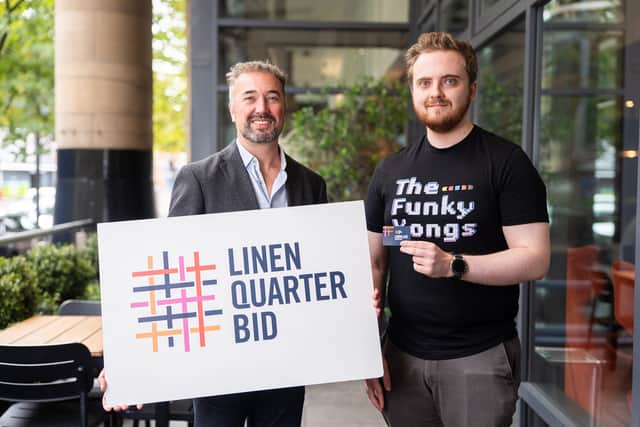 Chris McCracken, Managing Director at LQ BID with the 5000th Card Holder, Sam Purnell, Music Data Administrator at On Music