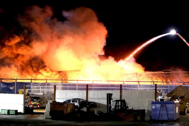 Firefighters tackle the huge blaze at commercial premises at Duncrue near Belfast docks on Friday night. At its height over 15 fire appliances from all over NI attended the fire. It could be seen from miles around Belfast and closed many roads in the area. Pic Steven McAuley/McAuley Multimedia