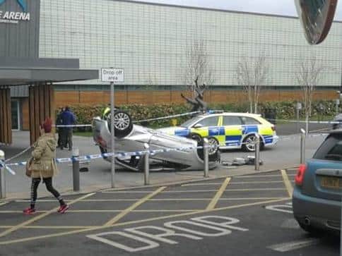The image of the overturned car outside Foyle Arena circulated on social media.