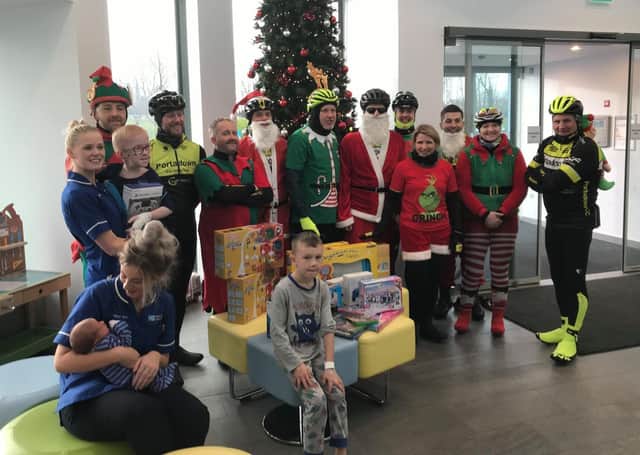 Portadown Cycle Club on their annual Santa Run delivering presents to children at Craigavon Hospital