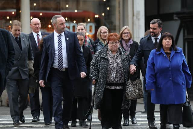 Sarah-Jane Young (centre), the daughter of Lance Corporal Young, a victim of the Hyde Park bombing, with her mother, Judith Jenkins (right), and Mark Tipper (left) arrive at the High Court in London to hear the ruling in the civil case brought by relatives of the Hyde Park bombing victims against convicted IRA member John Downey. Photo: Isabel Infantes/PA Wire