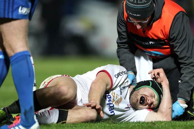 Ulster centre Angus Curtis suffers a knee injury during the game against Leinster