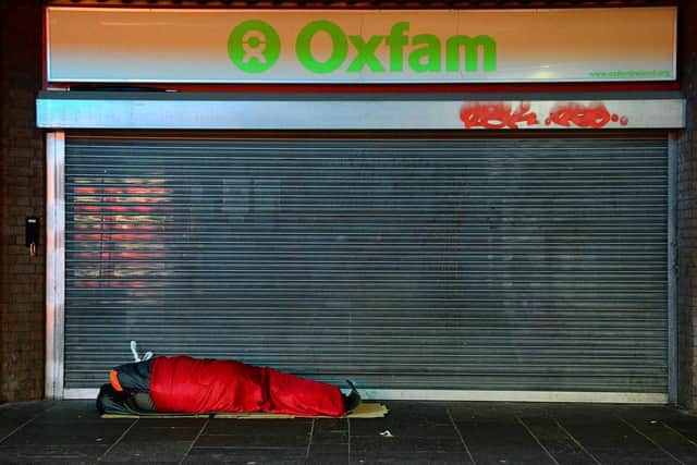 One of two homeless people sleeping in Belfast city centre before dawn on December 25. By David McConnell dtmccphotography