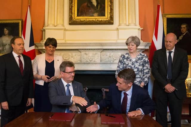 Theresa May with Damian Green (right), Arlene Foster, Nigel Dodds, as Sir Jeffrey Donaldson shakes hands with Tory Chief Whip, Gavin Williamson, in Downing Street for the DUP-Conservative deal in 2017. "In Theresa May the DUP faced a prime minister who was not only an instinctive  unionist in a way that Boris Johnson isn't, but who could surely have found much in common with Arlene Foster"