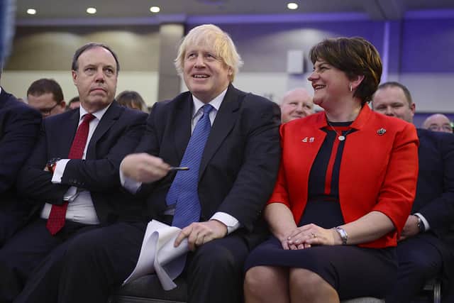 Boris Johnson with Nigel Dodds and Arlene Foster at the 2018 DUP conference in Belfast where he spoke out against any internal UK border. "Unionists have every right to be aggrieved at him abandoning his professedly iron-clad opposition to such a border but the fault for the failure of this relationship lies on both sides of the Irish Sea"  Picture Arthur Allison/Pacemaker Press
