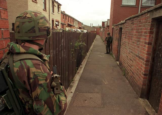 Those summarily killed by the IRA often had their bodies dumped publicly, such as here  were soldiers guard the scene of an IRA murder in west Belfast