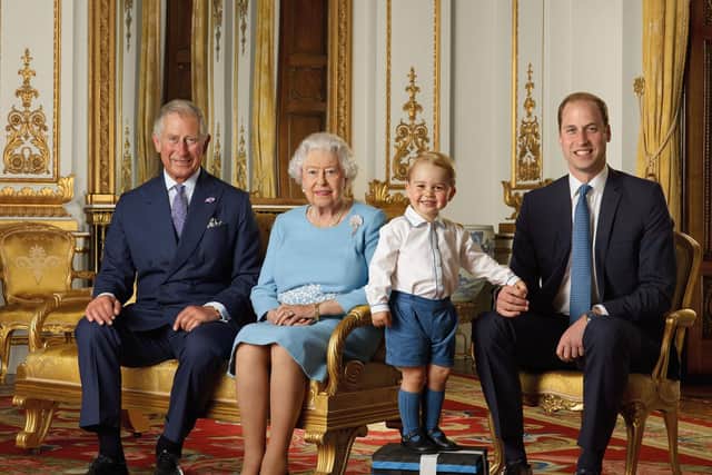 The Prince of Wales, Queen Elizabeth II, Prince George and the Duke of Cambridge. ,The picture was taken in the summer of 2015 in the White Drawing Room at Buckingham Palace