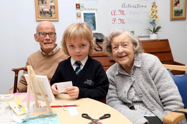 Grange Park P1 pupil Joshua Neely with Ken Tweedie and Grace Gordons at the Bayview Daycare Centre, Bangor. Photo Laura Davison/Pacemaker Press