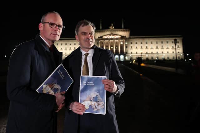 Irish Foreign Affairs minister Simon Coveney (left) and Secretary of State for Northern Ireland Julian Smith, outside Stormont Parliament buildings in Belfast, jointly unveil their deal. Photo: Niall Carson/PA Wire