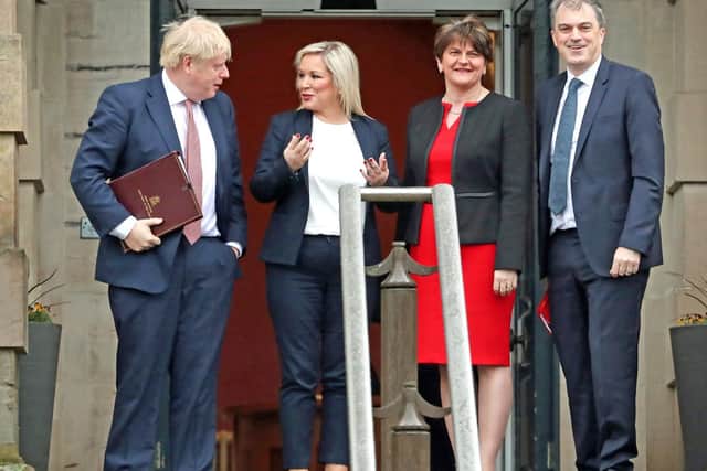 Prime Minister Boris Johnson (left), First Minister, Arlene Foster of the DUP (centre right), deputy First Minister Michelle O'Neill (centre left) of Sinn Fein, and Secretary of State for Northern Ireland, Julian Smith (right) during their visit to Stormont, Belfast