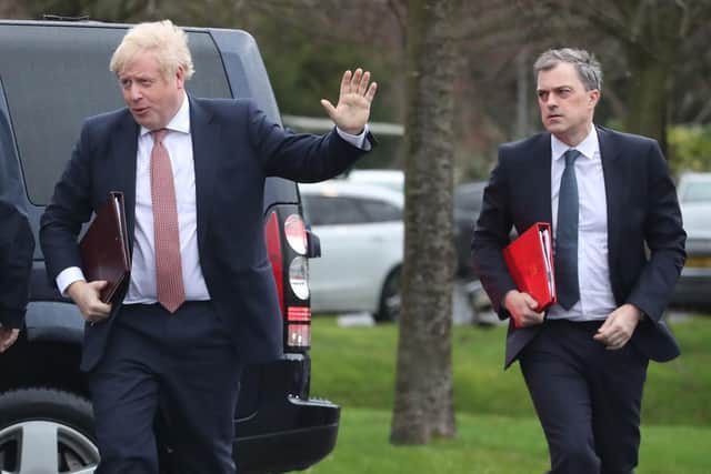 Prime Minister Boris Johnson (left) and Secretary of State for Northern Ireland, Julian Smith (right) during their visit to Stormont, Belfast