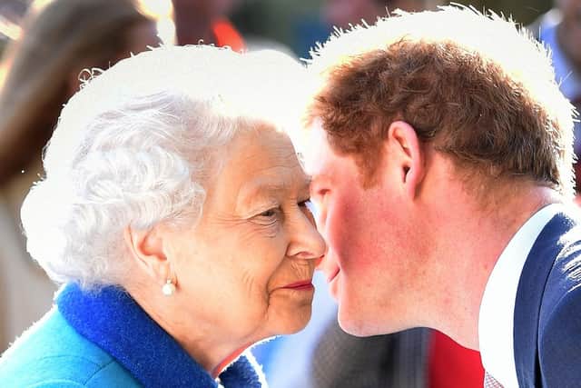 Queen Elizabeth II being greeted by her grandson the Duke of Sussex.