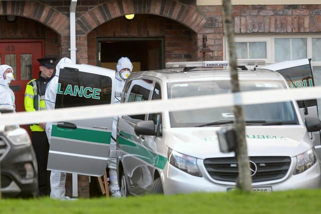 An ambulance outside a house in the village of Newcastle, south west of Dublin city where three children were found dead on Friday