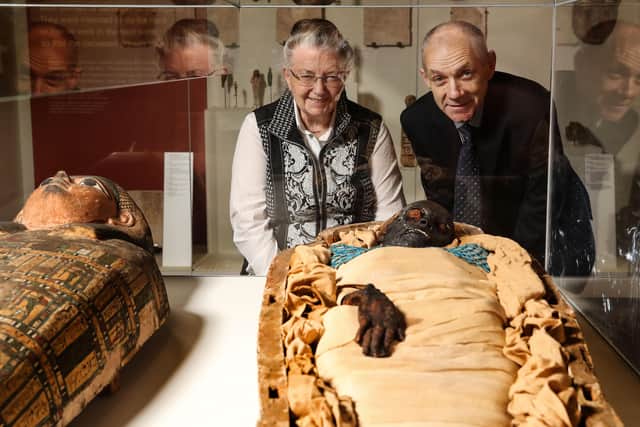 Professor Rosalie David OBE, Egyptologist and Emeritus Professor at University of Manchester and Dr Greer Ramsey, Curator of Archaeology at National Museums NI with Takabuti at the Ulster Museum, Belfast.