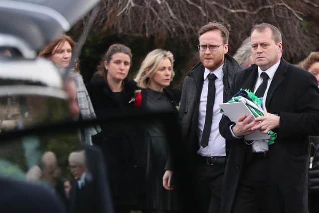 Andrew McGinley (right) during the funeral of his children, Conor, nine, Darragh, seven and Carla,