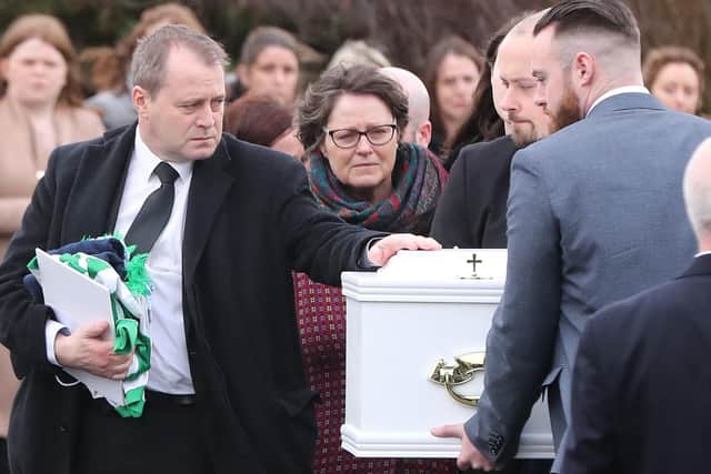 Andrew McGinley during the funeral of his children, Conor, nine, Darragh, seven and Carla,  three, who were found dead in their home at Parson's Court in Newcastle, in the south-west of Dublin city on Friday, at the Church of the Holy Family in Rathcoole, Dublin