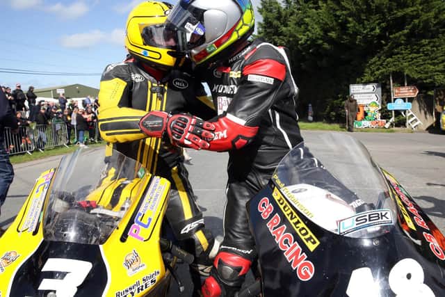 Gary Dunlop and Paul Robinson embrace at the Killalane Road Races in 2018, which was Robinson's final race.
