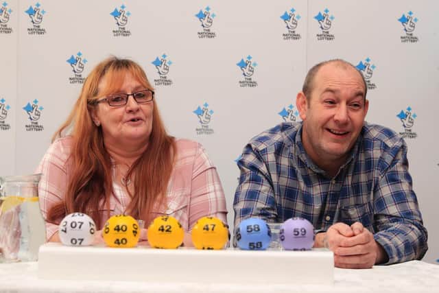Malcolm and Bev Dixon, grandparents of 13 from Bolton, celebrating their one million pound lottery win at the Mercure Haydock Hotel in Haydock. PA Photo: Pete Byrne/PA Wire
