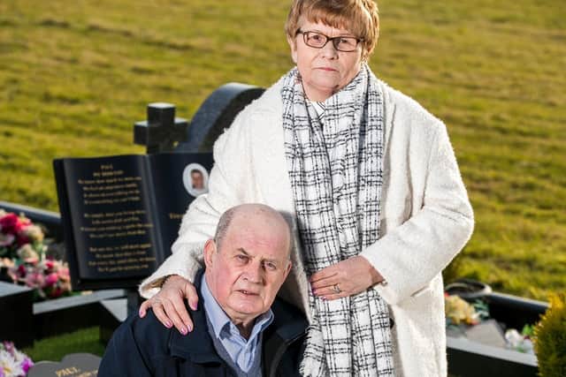 Paul Quinn's parents at his grave