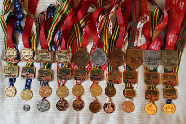 Ken’s London Marathon medal haul. The bottom left medal is from the first marathon in 1981.