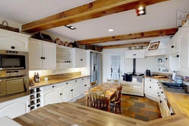 The property features an open plan kitchen & dinette