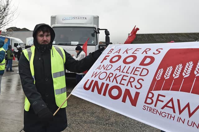 PACEMAKER BELFAST  16/02/2020
Workers  at Allied Bakeries in East Belfast on Strike  on Sunday over pay, The factory which  makes products such as Kingsmill bread.
This is one of the busiest weeks of the year at the site, which is part of Associated British Foods. The multinational company owns a series of brands, including clothes retailer Primark, and posted profits of around £1.4 billion last year.
A Kingsmill lorry stopped at the gates where dozens of workers carrying red Unite the Union flags demonstrated in the morning chill. Local police mediated.
Photo Colm Lenaghan/Pacemaker Press