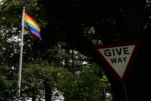 A gay pride flag flying outside the Northern Ireland Office in Stormont; the NIO is now drawing up guidelines to protect clergy from being forced to do gay weddings – but they plan to offer no protection to businesses