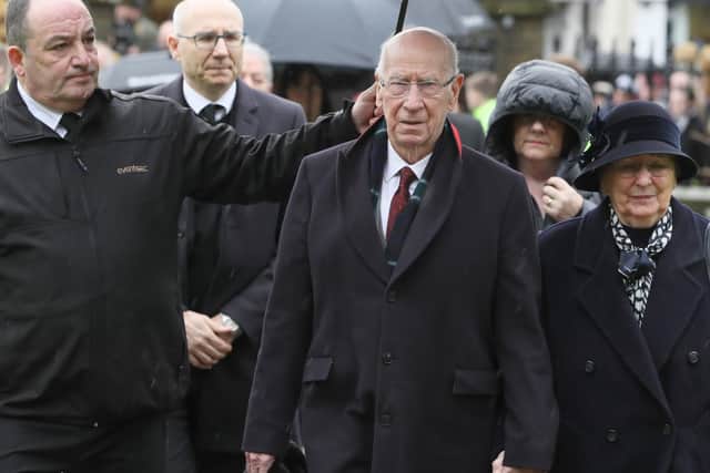 Sir Bobby Charlton and wife Norma arrive for the funeral of former Manchester United and Northern Ireland goalkeeper Harry Gregg, at St Patrick's Parsh Church, Coleraine. PA Photo.