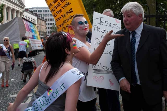 A confrontation between gay pride marchers and a Christian protestor at Belfast City Hall