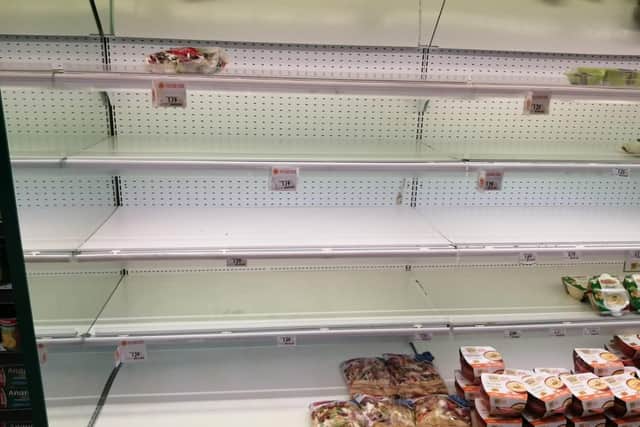 Empty supermarket shelves in Fabriano, Italy, as normally sociable Italians stock up on supplies