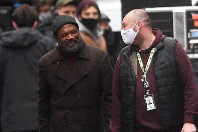 Samuel L Jackson appeared in good spirits as he shared a joke with a crew member in-between takes. Picture: Simon Hulme.