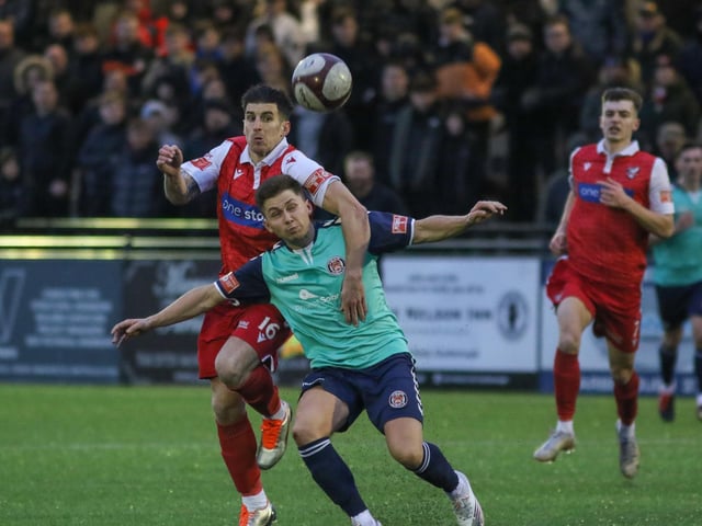 Michael Coulson gets to grips with  Hyde player

Photo by Morgan Exley