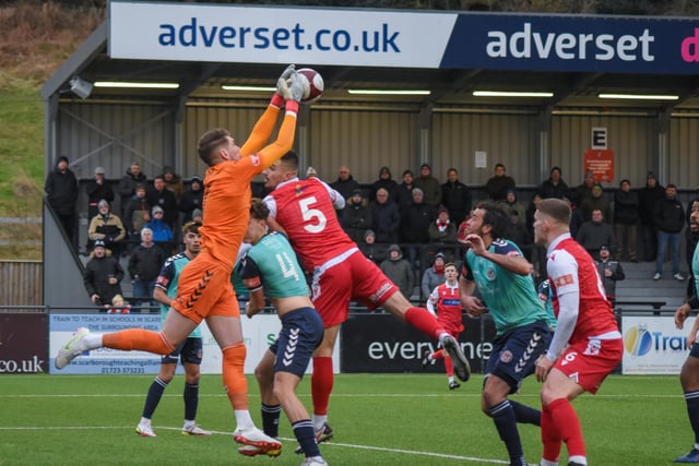 The Hyde keeper claims the ball safely