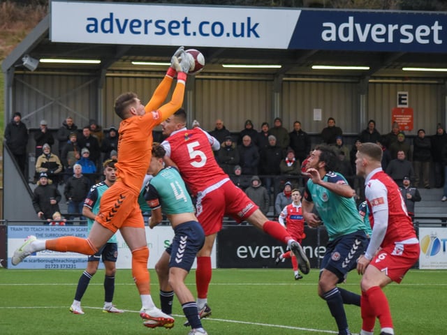 The Hyde keeper claims the ball safely