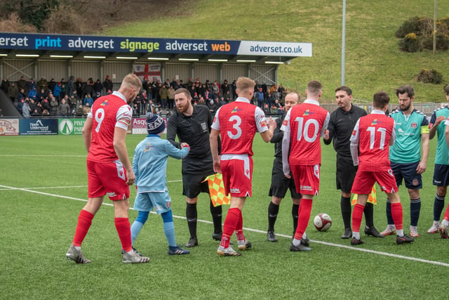The teams shake hands before kick-off

Photo by Morgan Exley