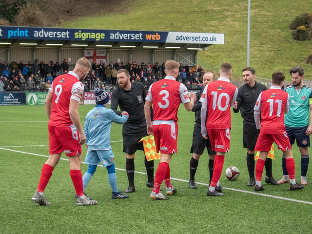 The teams shake hands before kick-off

Photo by Morgan Exley